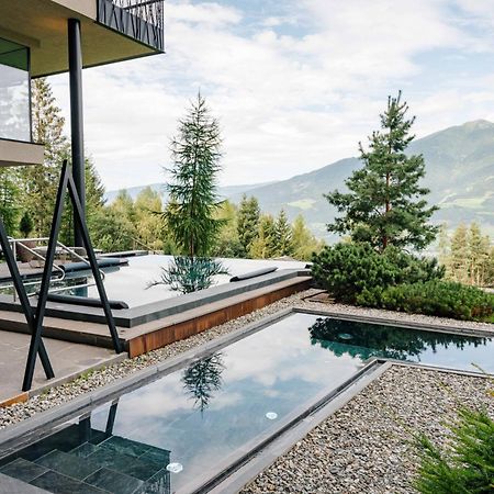 My Arbor - Dolomites Hotel Bressanone Exterior foto A private swimming pool in the Alps
